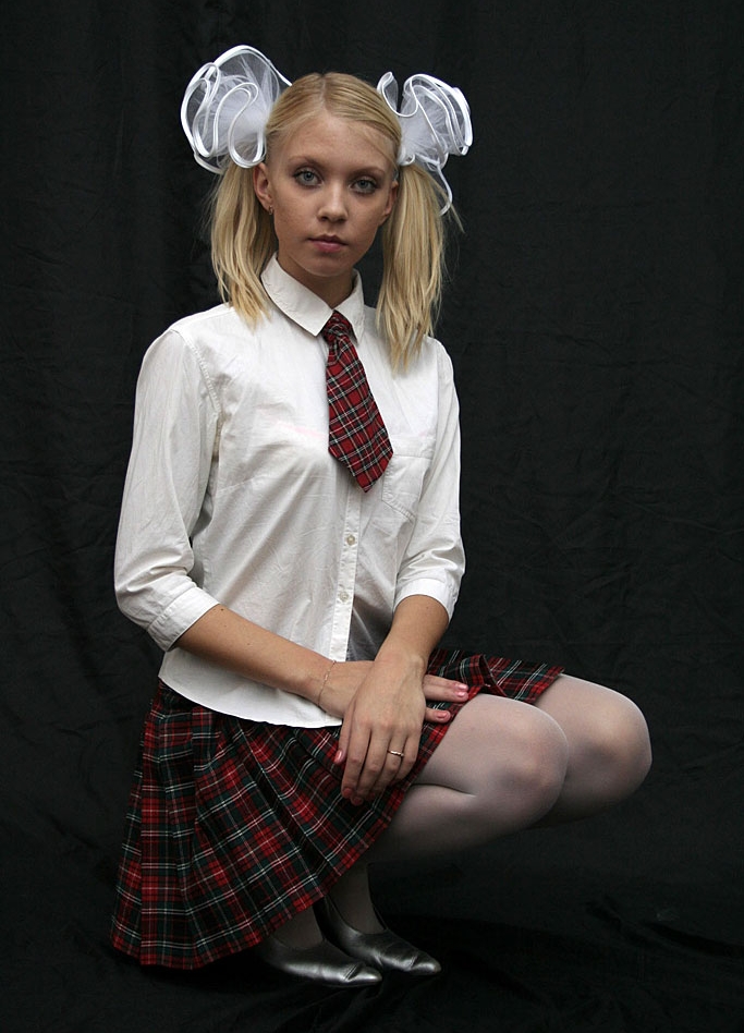 Blonde Schoolgirl wearing White Sheer Pantyhose and Black High Heels
